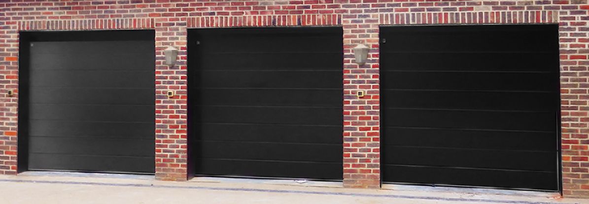 Three garage doors in a row of garages